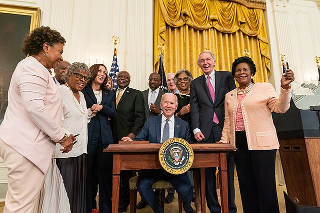 President Joe Biden, joined by Vice President Kamala Harris, lawmakers and guests, signs the Juneteenth National Independence Day Act Bill on Thursday, June 17, 2021, in the East Room of the White House. 